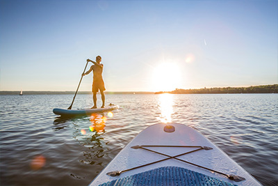 Man paddleboarding in the sea