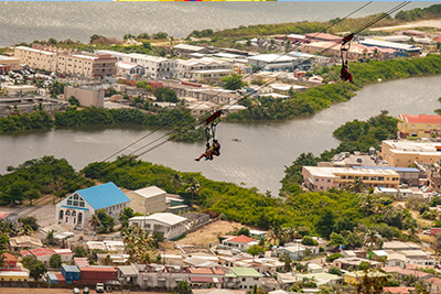 A couple ziplining over St Martin